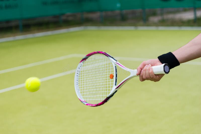 Tennis racket and ball in action