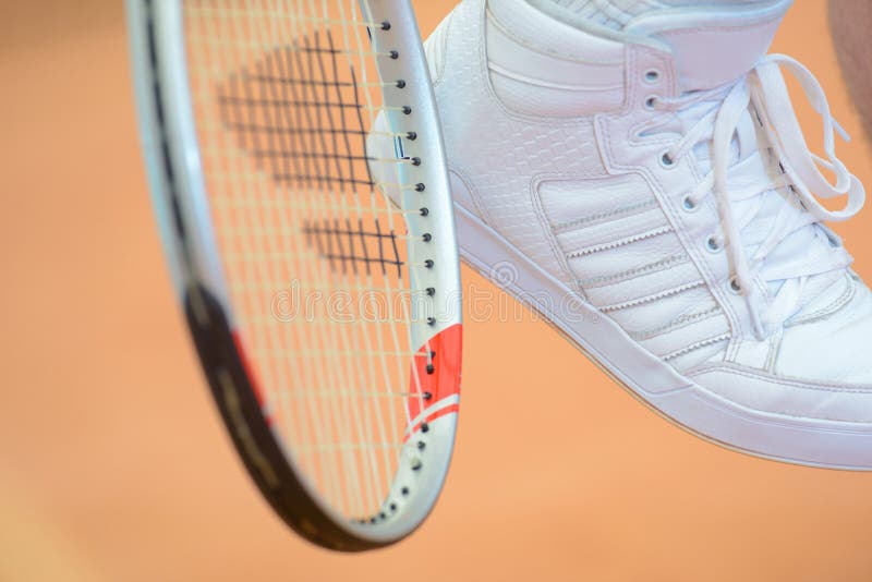 Tennis racket and shoe stock photo. Image of ball, court 130816612