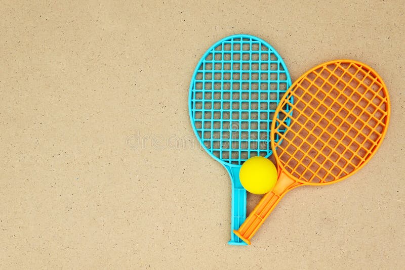 Tennis rackets and ball on the table