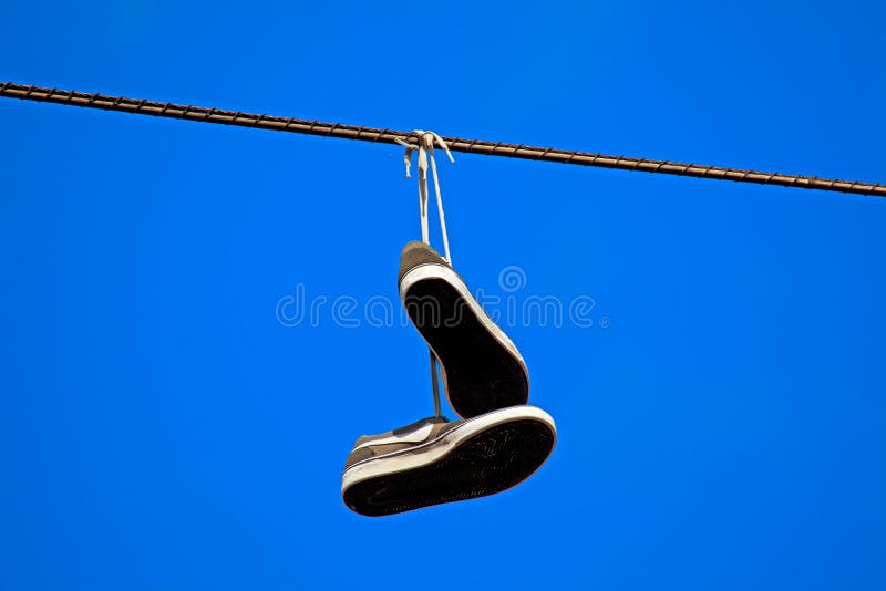 Tennis Shoes Hanging From A Power Line Stock Photos - Image: 20675853