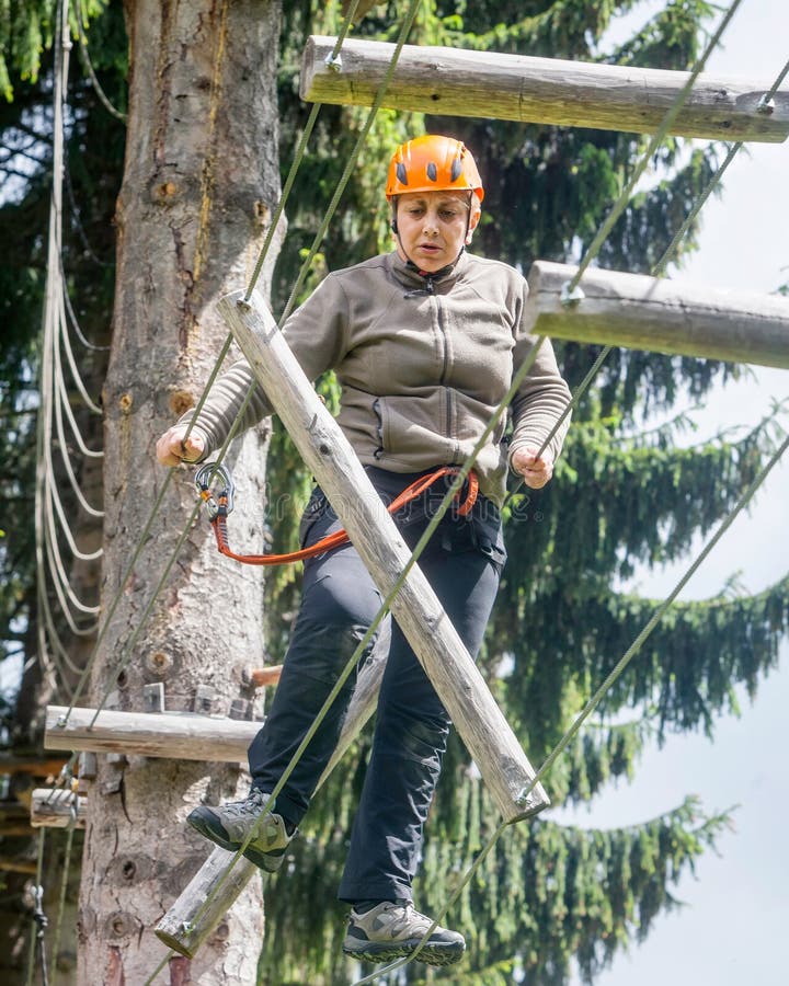 Tense Romanian Tourist Woman In Rausor Adventure Park stock photo Tense Romanian Tourist Woman In Rausor Adventure Park stock photo