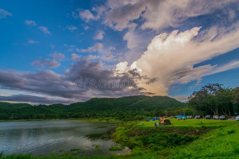 Tent spots along the reservoir in the middle of the forest and lake Resting place pubbic cludy sky rain coming