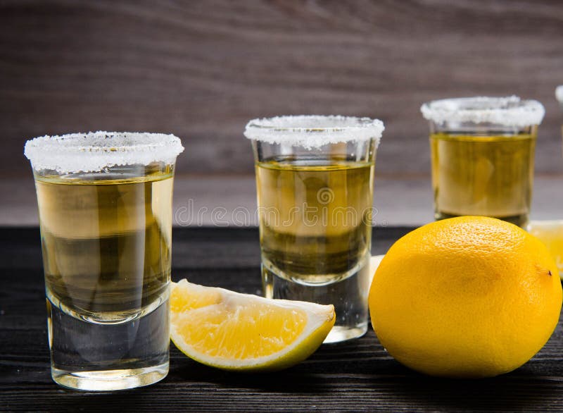 Tequila Drink Served in Glasses with Lime and Salt Stock Photo - Image ...