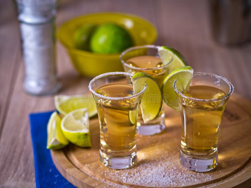 Shot of Gold Tequila with Lime Slice Stock Photo - Image of drink ...