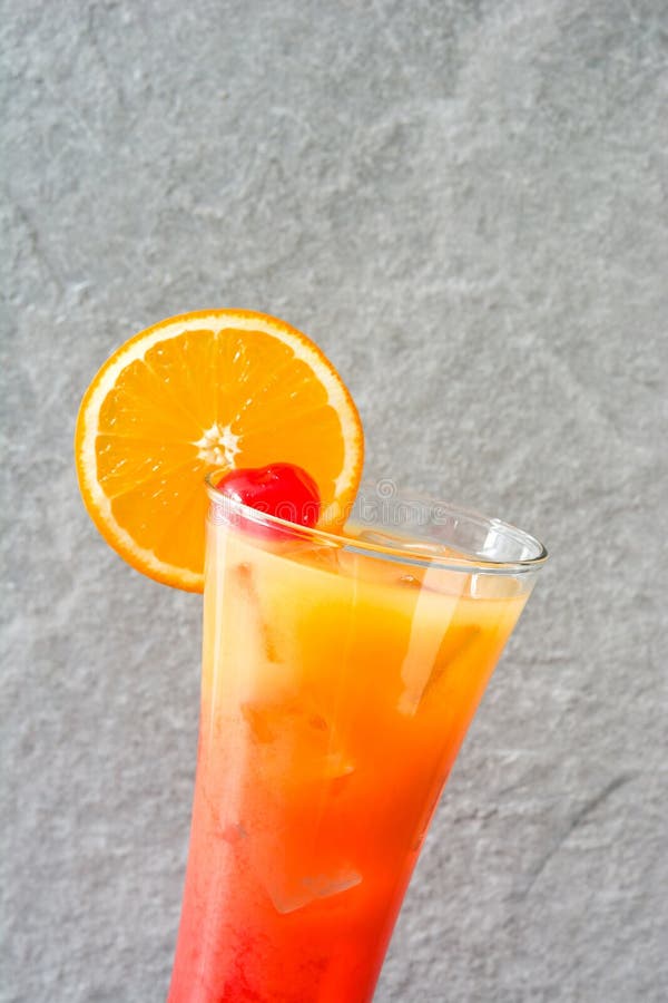 Tequila Sunrise Cocktail in Glass on Gray Stone Stock Photo - Image of ...