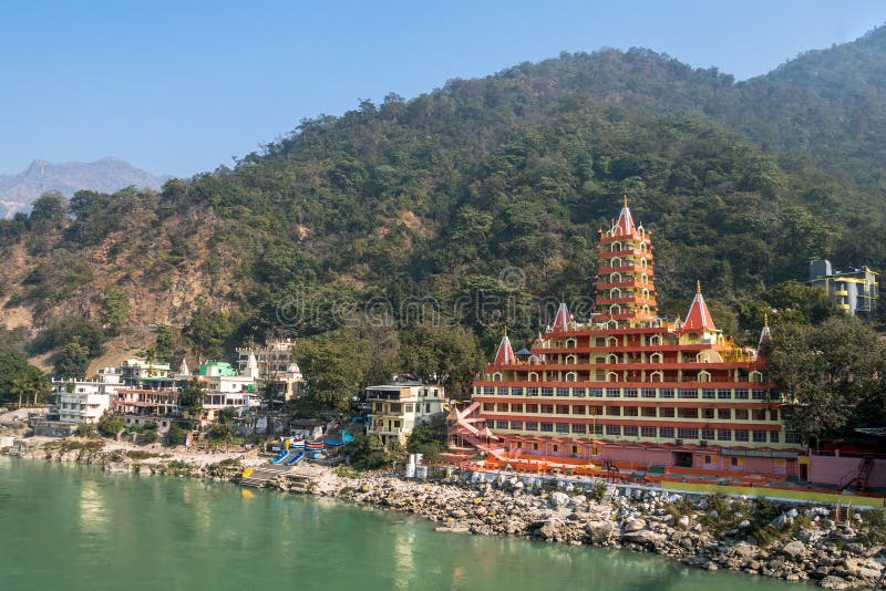 Tera Manzil Templ, another name - Trimbakeshwar, view from Lakshman Jhula bridge. the temple is similar to a layer cake on the