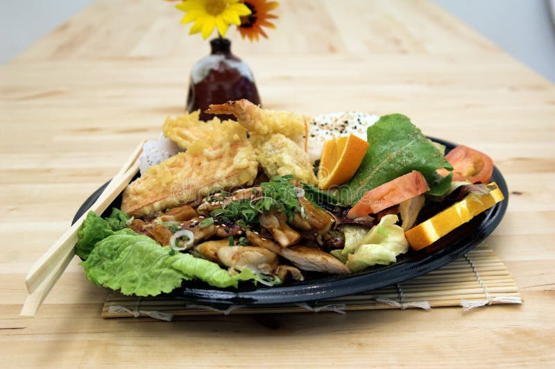 Combo MisoYaki Chicken combo plate with tempura shrimp, tempura vegetables and an asian soy ginger salad, steamed rice and oranges. Combo MisoYaki Chicken combo plate with tempura shrimp, tempura vegetables and an asian soy ginger salad, steamed rice and oranges