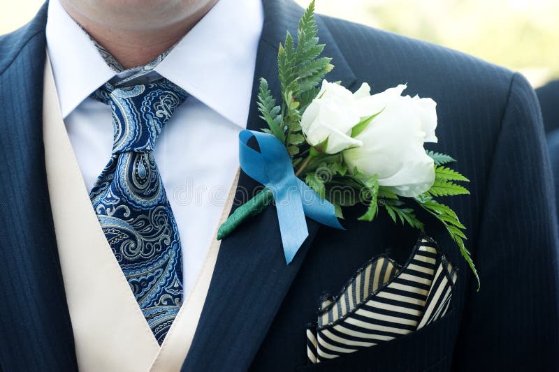 Closeup of a ceremony suit with a flower. Closeup of a ceremony suit with a flower