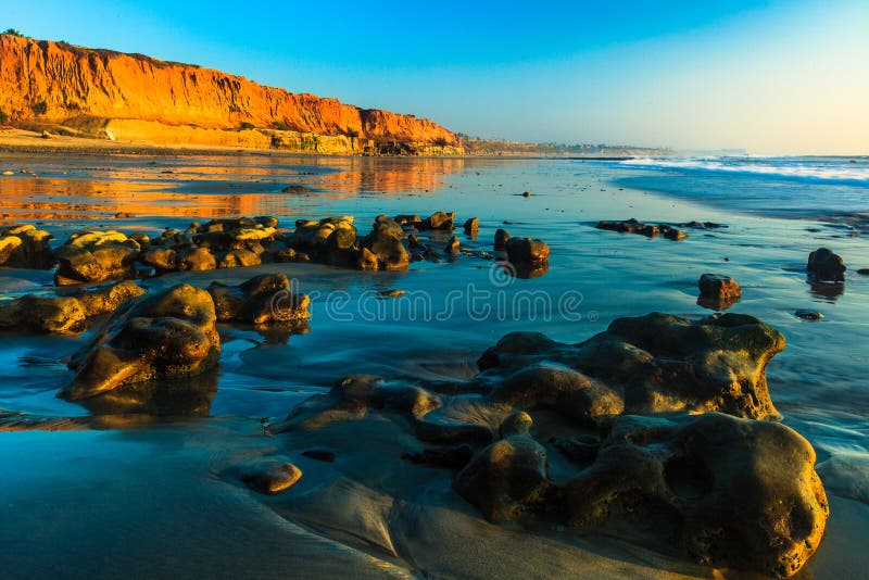 This landscape image of the beach Terra Mar at Carlsbad, California was captured at sunset one winter day.   The photograph was taken at low tide. This landscape image of the beach Terra Mar at Carlsbad, California was captured at sunset one winter day.   The photograph was taken at low tide.