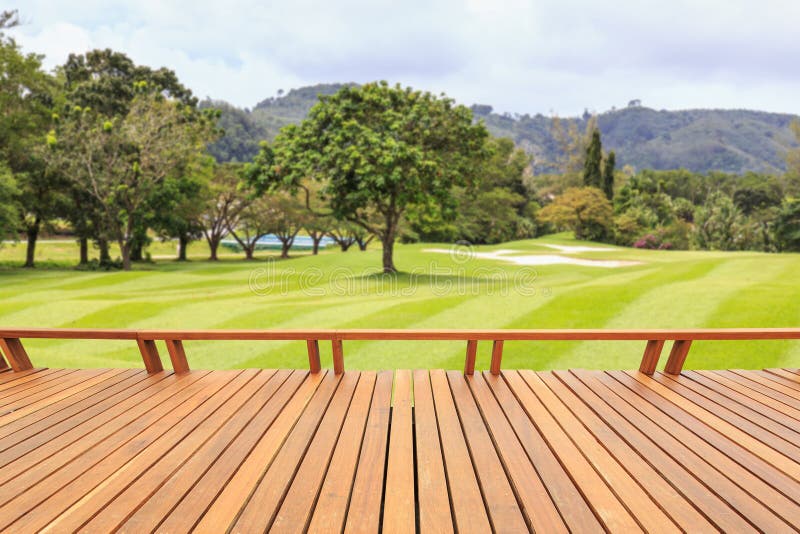 Hardwood decking or flooring and view of green field in golf course. Garden decorative royalty free stock images Hardwood decking or flooring and view of green field in golf course. Garden decorative royalty free stock images