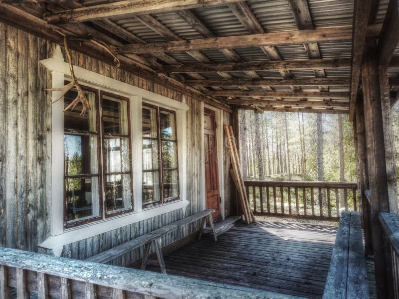 Terrace of a Traditional Swedish Log Cabin in the Forest Stock Image