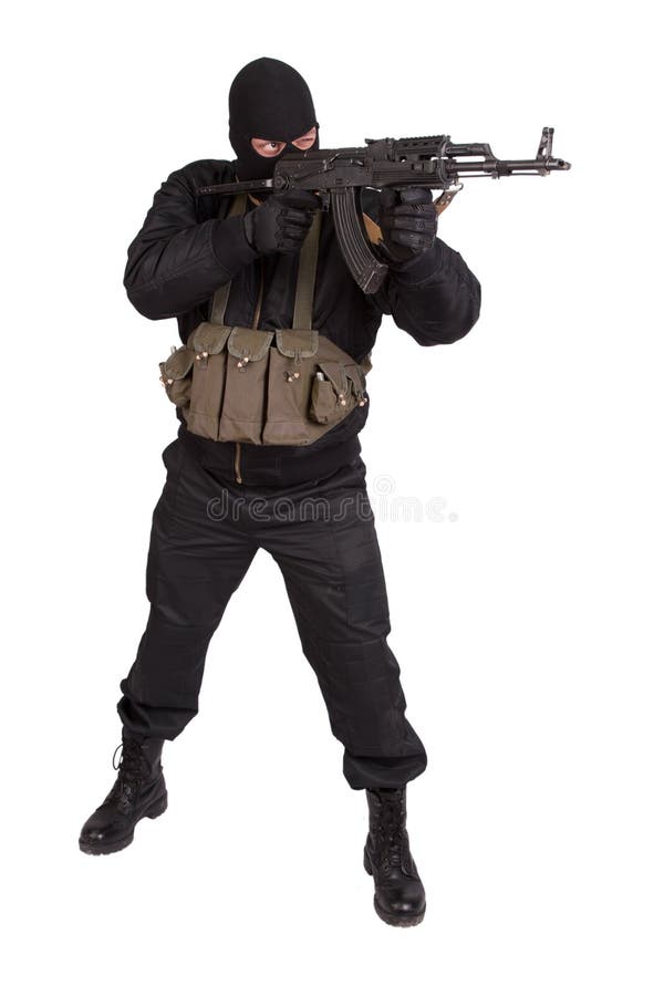 Terrorist in black uniform and mask with kalashnikov isolated