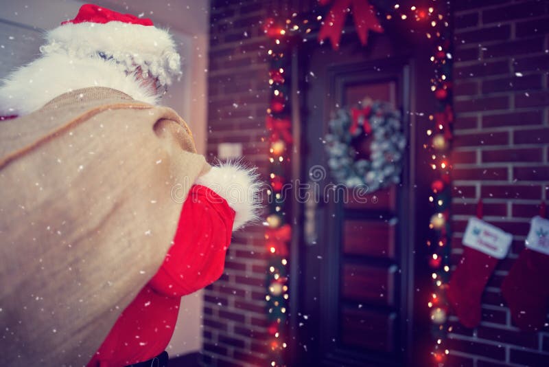 Terug van de Kerstman in voordeur, achtermening royalty-vrije stock afbeeldingen Terug van de Kerstman in voordeur, achtermening royalty-vrije stock afbeeldingen