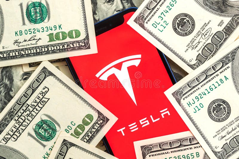 Tesla car company stock market background. Tesla logo on Twitter and dollar money close-up view photo