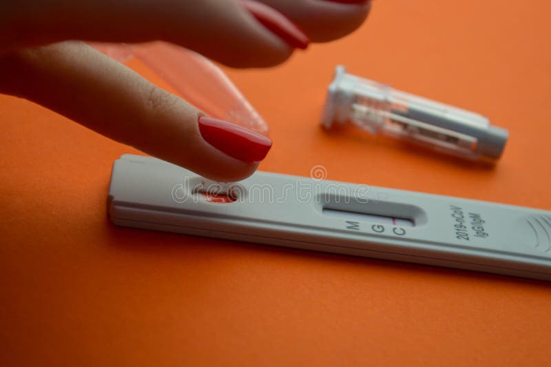 Test for Coronavirus on an Orange Background on a Matte Background a