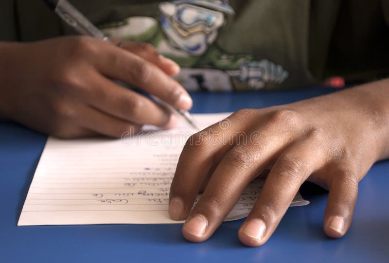 A child doing written exercise/test. A child doing written exercise/test