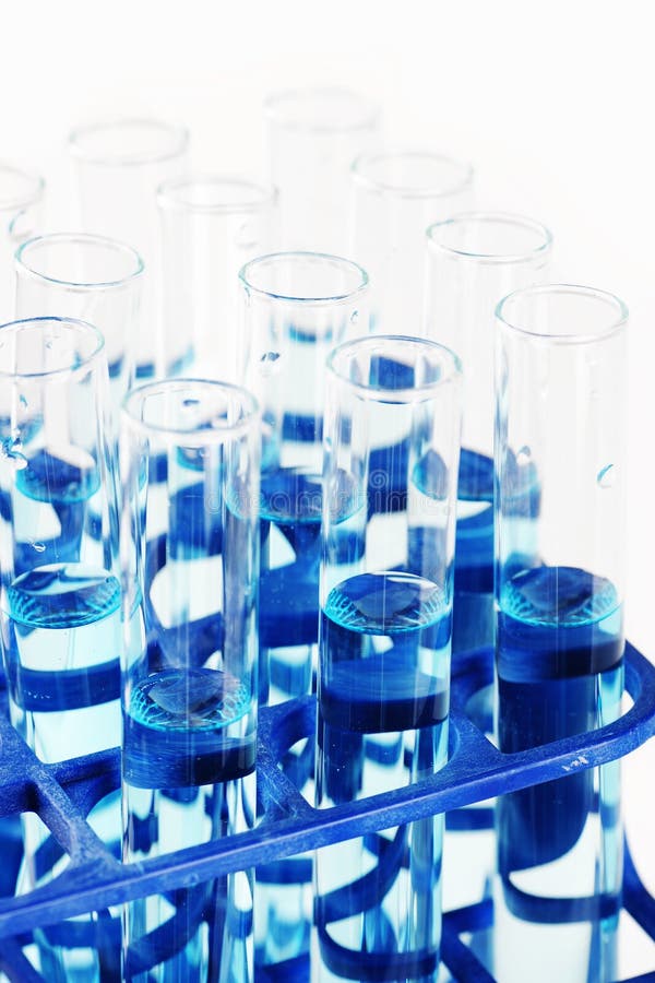 Test tubes with blue liquid stock images