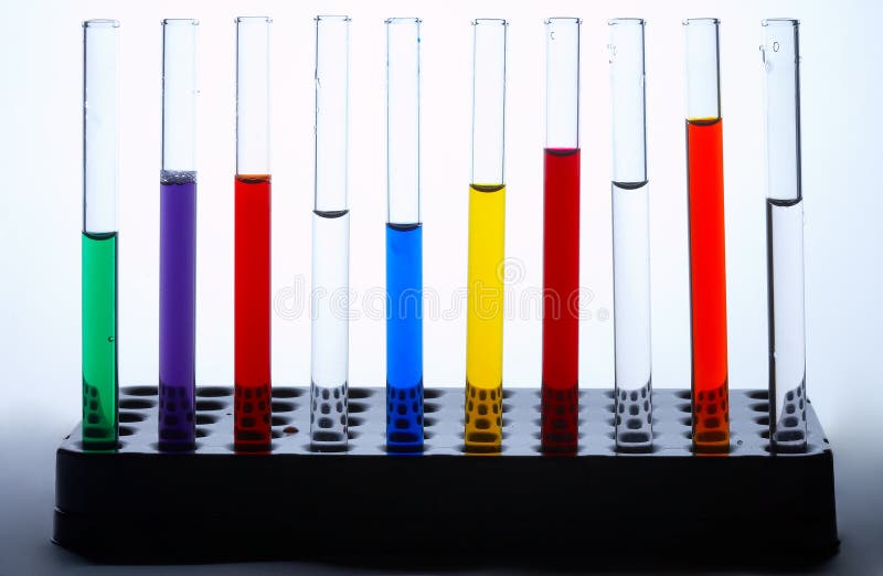 Glass test tubes standing in a line filled with colorful liquids. Glass test tubes standing in a line filled with colorful liquids