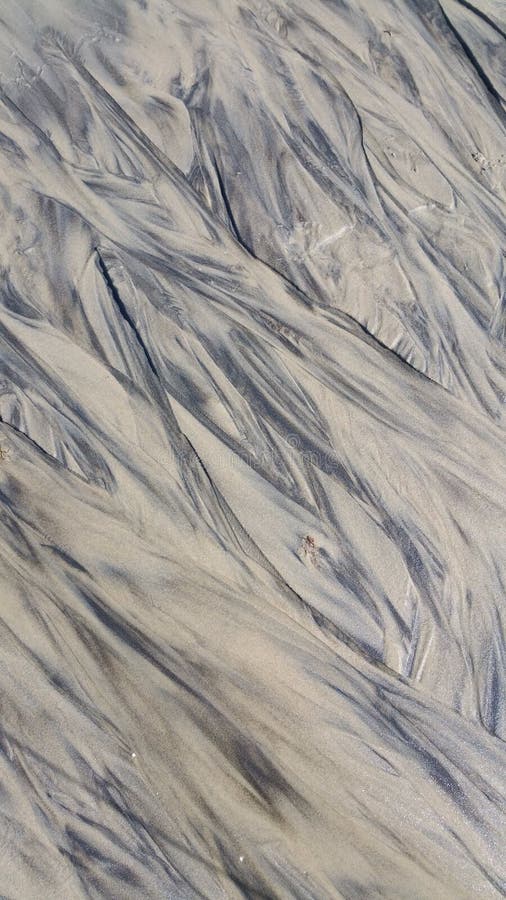 Testes padrões abstratos na areia na praia no vinhedo Massachusetts EUA do ` s de Martha imagens de stock Testes padrões abstratos na areia na praia no vinhedo Massachusetts EUA do ` s de Martha imagens de stock