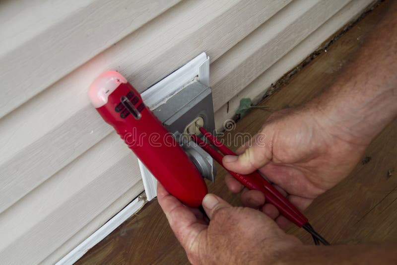 Testing a Electrical Outlet on a Patio Stock Image Image of meter