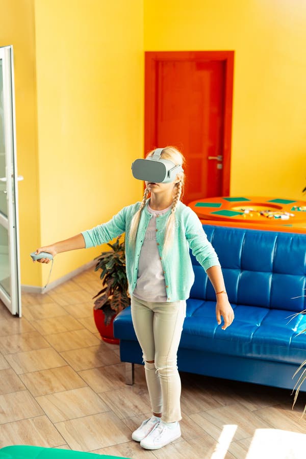 Girl looking around during her virtual walk. stock photography