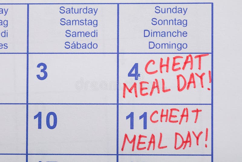 Testo di giorno del pasto dell'imbroglione scritto sul calendario immagine stock libera da diritti Testo di giorno del pasto dell'imbroglione scritto sul calendario immagine stock libera da diritti