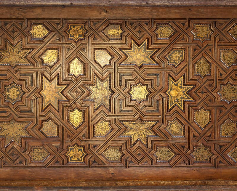 A intricate gilded wooden ceiling from a Moroccan mosque. A intricate gilded wooden ceiling from a Moroccan mosque