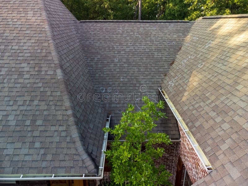 Roof with hail damage and chalk markings from inspection. Roof with hail damage and chalk markings from inspection