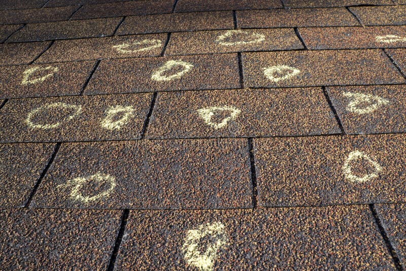 Insurance adjuster marked the hail damage on a insureds roof. Insurance adjuster marked the hail damage on a insureds roof.