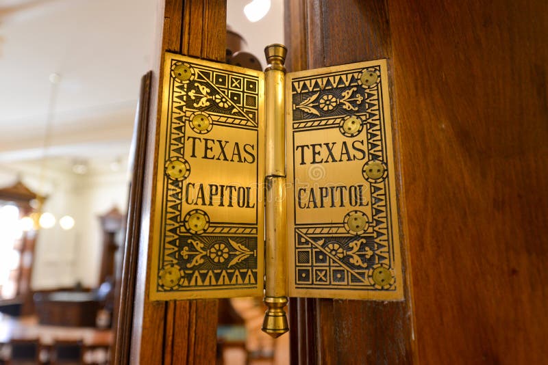 Detailed hinge on the doors of the state capitol of Texas in Austin. Detailed hinge on the doors of the state capitol of Texas in Austin.