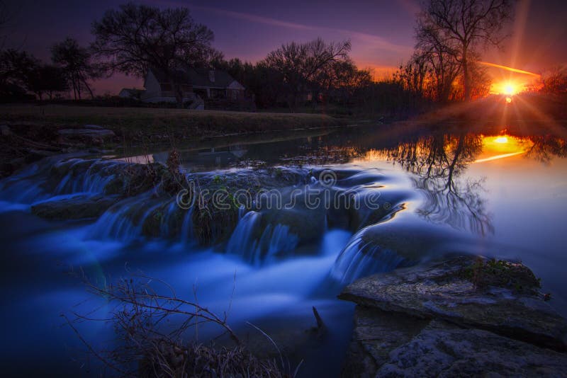 Texas country sunset with a silky little waterfall. Texas country sunset with a silky little waterfall