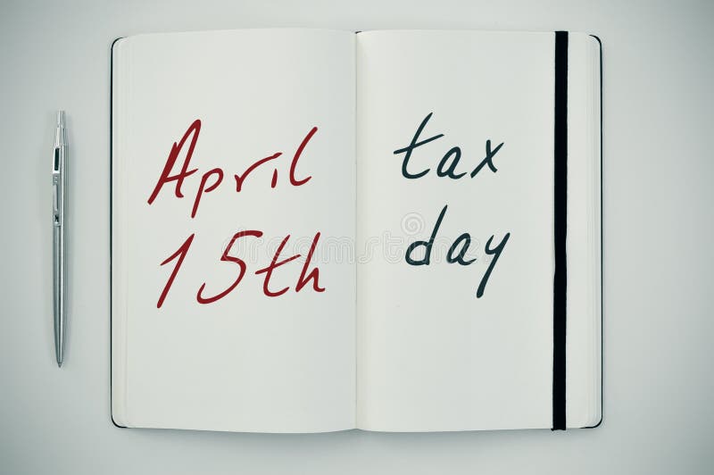 Text april 15th tax day in a notepad stock photography