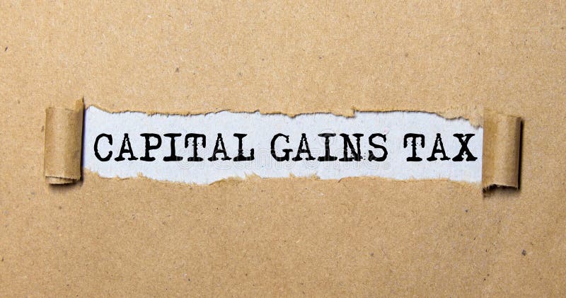 text CAPITAL GAINS TAX, on torn paper