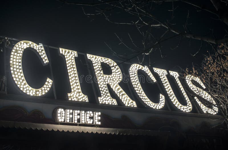 Text circus in the night. Circus office illuminated stock image