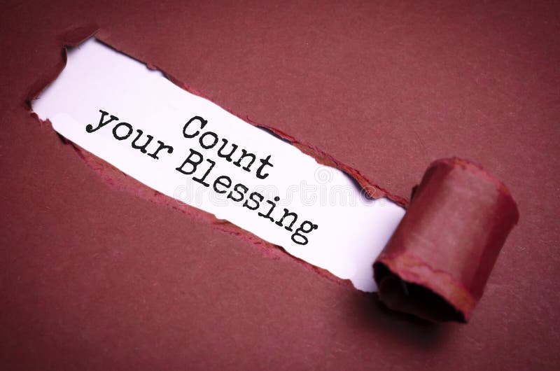 the-text-count-your-blessing-appearing-behind-torn-brown-paper-stock