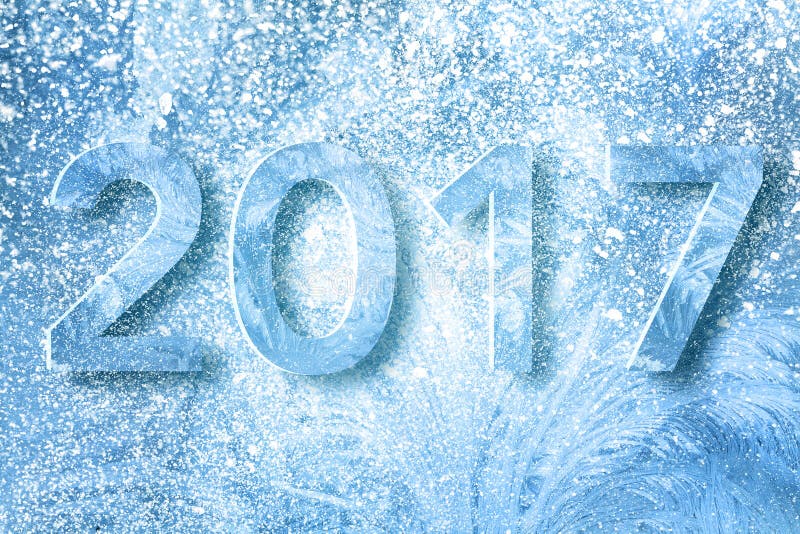 New year 2017 digits text design made from snow and ice frost texture over blue background. New year 2017 digits text design made from snow and ice frost texture over blue background