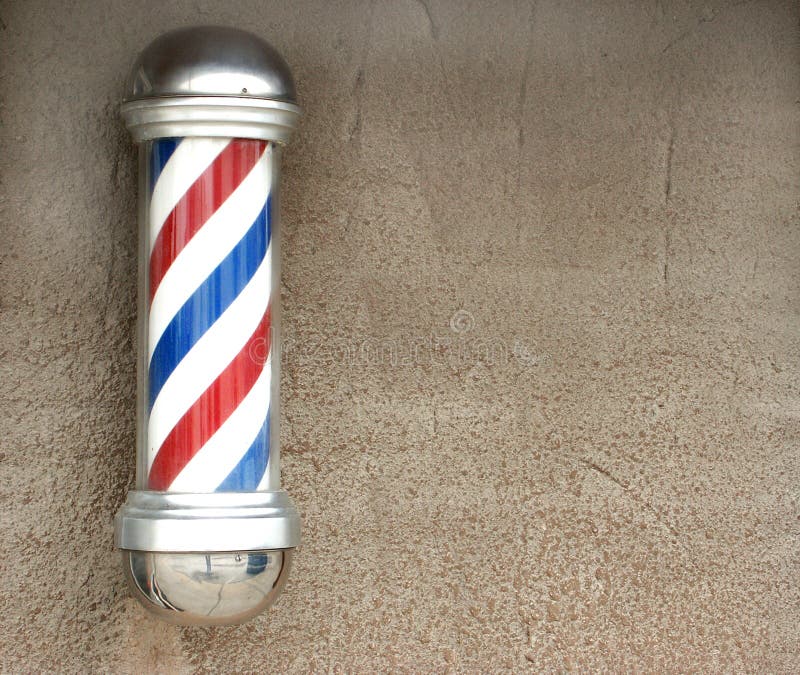 Traditional white, red, and blue barber's pole with wall space for text. Traditional white, red, and blue barber's pole with wall space for text