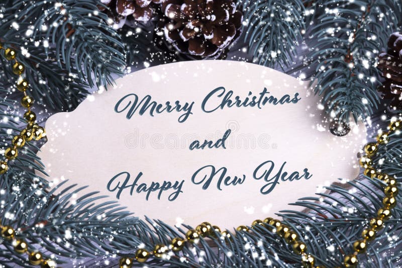 Christmas Xmas New Year Holiday greeting card wooden tablet text Merry Chrismas and Happy New Year fir branches cones gold necklace snowflakes space for text decoration. Christmas Xmas New Year Holiday greeting card wooden tablet text Merry Chrismas and Happy New Year fir branches cones gold necklace snowflakes space for text decoration