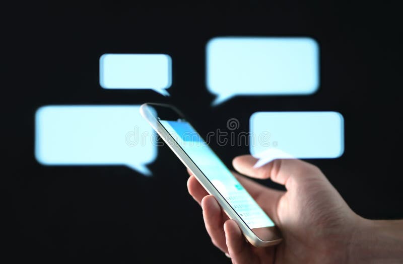 Text messages in cellphone screen with abstract hologram speech bubbles. Instant messaging app. Texting, group chat, sexting or sms concept. Customer service help desk with live support chatbot. Text messages in cellphone screen with abstract hologram speech bubbles. Instant messaging app. Texting, group chat, sexting or sms concept. Customer service help desk with live support chatbot