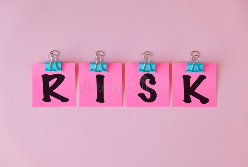 Text showing inspiration Risk on pink sticky paper royalty free stock photo