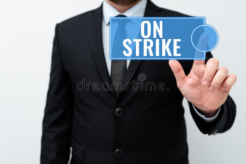 Text showing inspiration On Strike. Word for refuse to continue working because of an argument with an employer stock photography