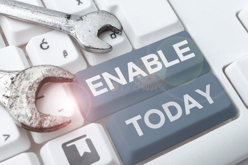 Text sign showing Enable. Word for give someone or something the authority or means to do something stock photography