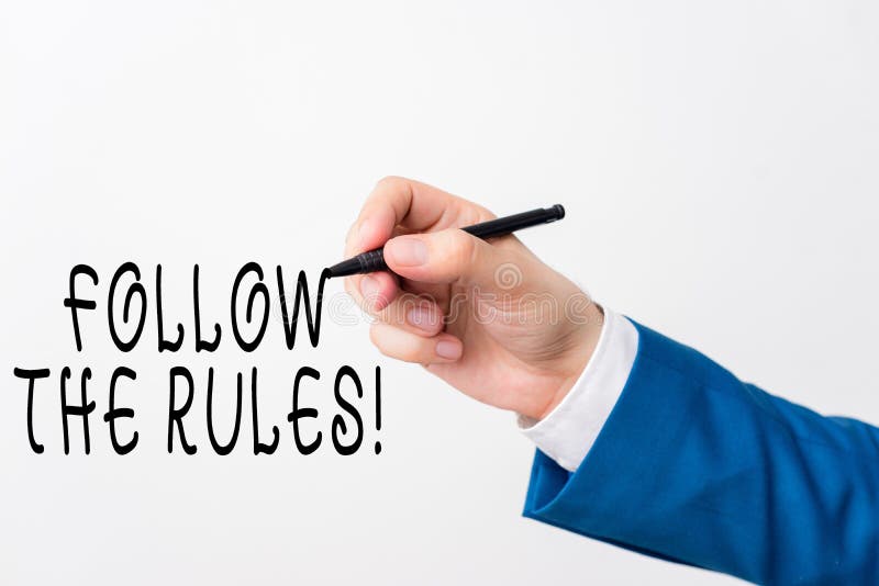 Text sign showing Follow The Rules. Conceptual photo go with regulations governing conduct or procedure Isolated hand