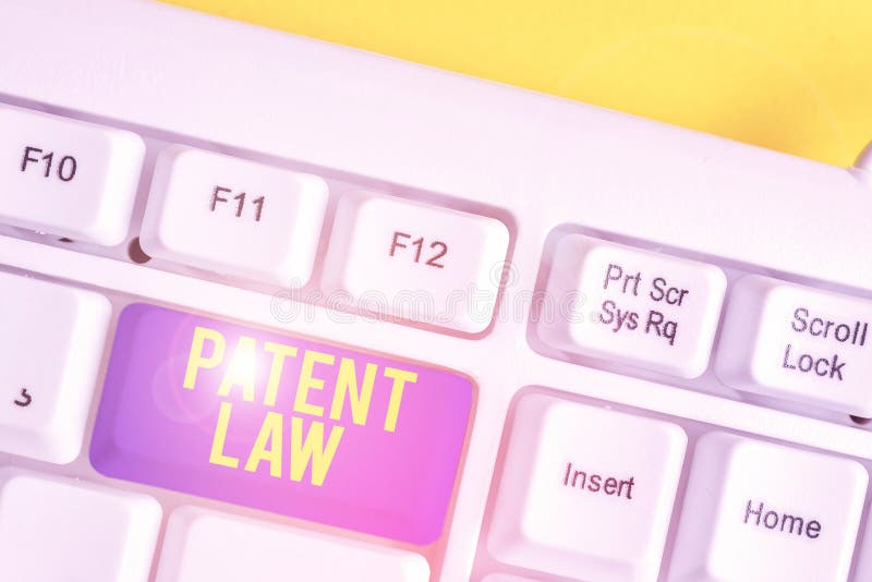 Text sign showing Patent Law. Conceptual photo deals with an inventor s is exclusive right to use own invention White pc royalty free stock photos