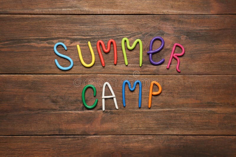Text SUMMER CAMP made of modelling clay, flat lay stock images Text SUMMER CAMP made of modelling clay, flat lay stock images