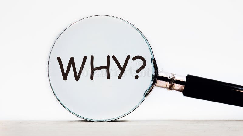 The text WHY Through a magnifying glass on a light background. The concept of finding answers to questions royalty free stock photography