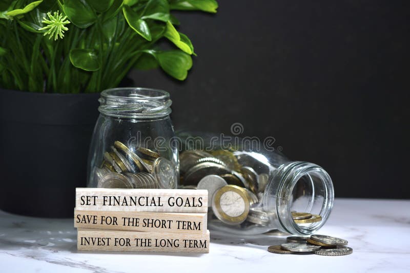 Text on wood block with Australia dollar and European coins on table surface