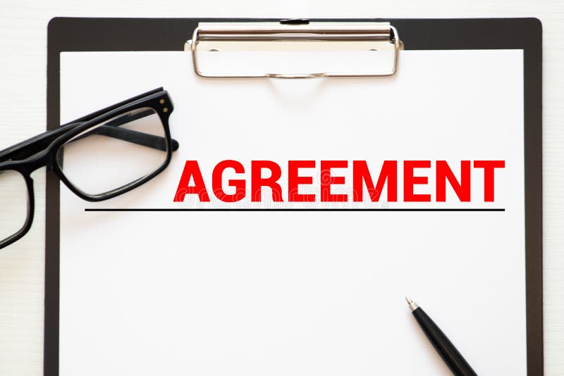 Text, word AGREEMENTS is written on a folder lying on documents on an office desk. Business concept. Desk business concept stock images, royalty-free photos and pictures