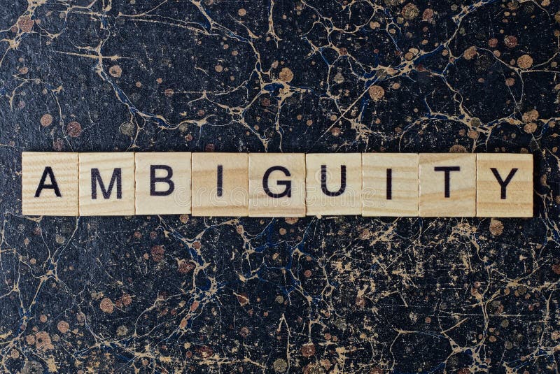 text the word ambiguity from gray wooden small letters with black font