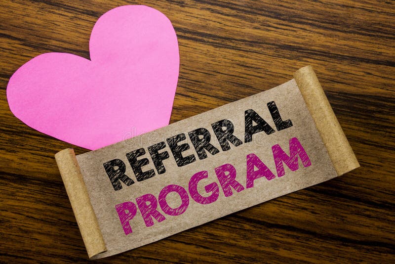 Writing text showing Referral Program. Business concept for Refer Marketing written on sticky note paper, wooden background. With pink heart meaning love adoration. Writing text showing Referral Program. Business concept for Refer Marketing written on sticky note paper, wooden background. With pink heart meaning love adoration.